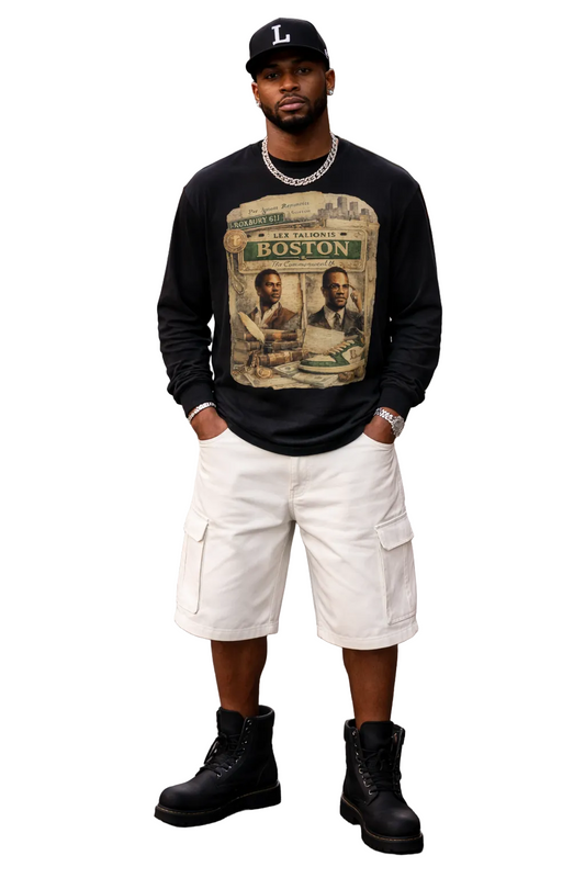 Man wearing a black sweatshirt with a graphic design, white cargo shorts, and black boots on a city street.