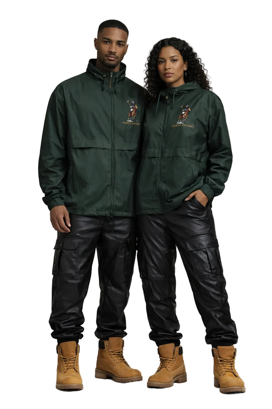 Two people wearing matching green jackets and black pants on a plain background