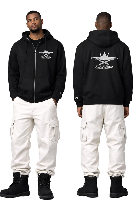 Person wearing a black hoodie with a logo and text, paired with white cargo pants on a white background.