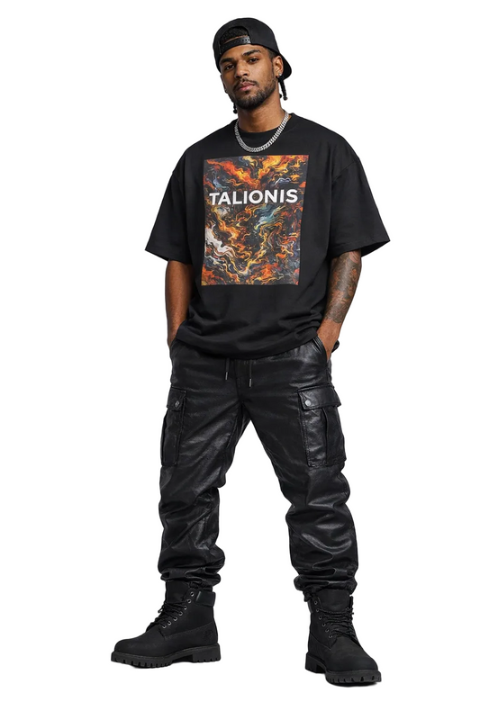 Man wearing a black t-shirt with 'Talionis' design, black pants, and black boots on a gray background