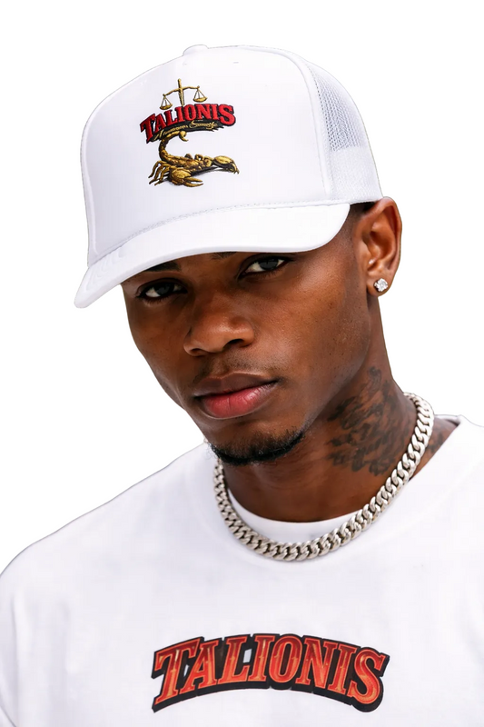 Person wearing a white cap and shirt with 'Talionis' branding.