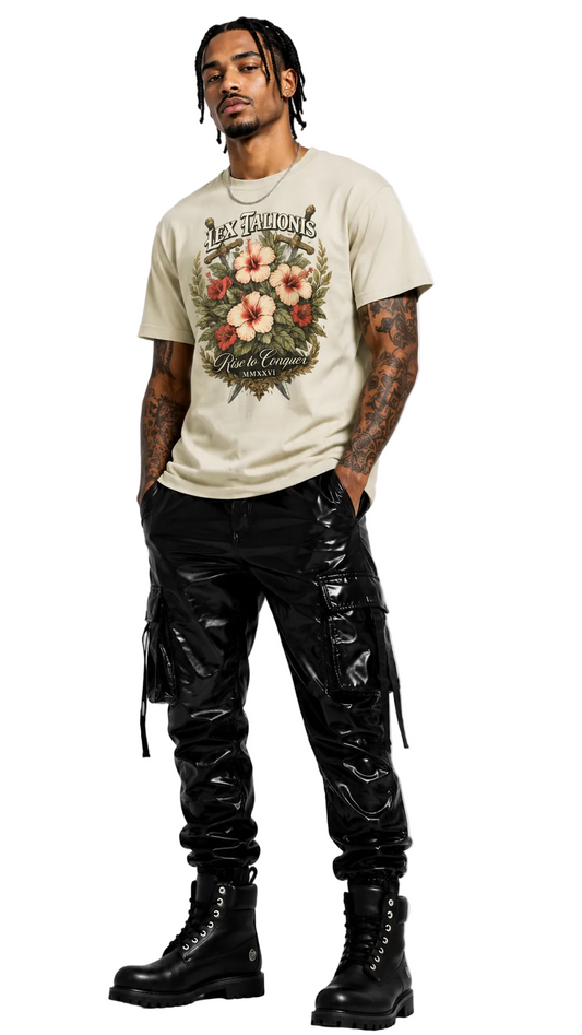 Man wearing a graphic t-shirt and black pants with reflective material on a white background