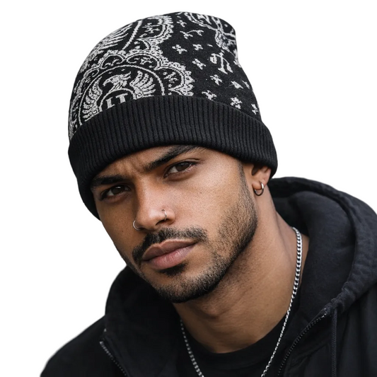 Man wearing a black beanie with white patterns and a black hoodie on a white background