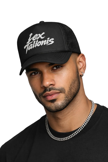 Man wearing a black cap with 'Lex Talionis' text on a white background