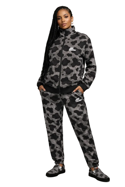 Person wearing a camouflage tracksuit with a brand logo on a white background