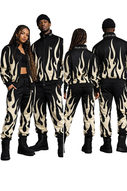 Two people wearing matching black and white flame-patterned outfits on a gray background.