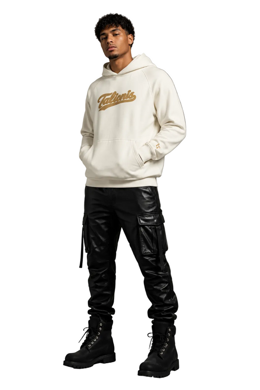 Person wearing a white hoodie with text, black cargo pants, and black boots against a gray background