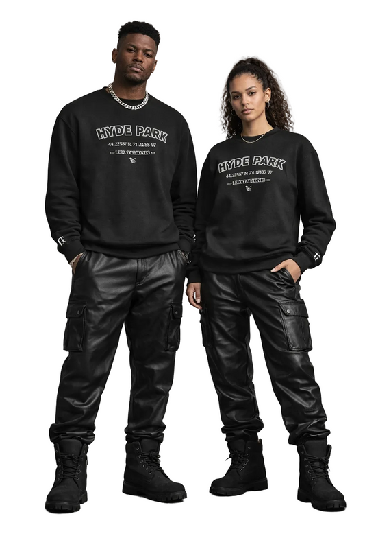 Two people wearing matching black sweatshirts with 'Hyde Park' text, standing against a gray background.