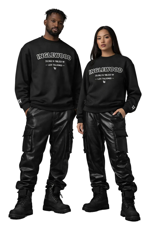 Two people wearing matching black sweatshirts with 'Inglewood' text on a gray background