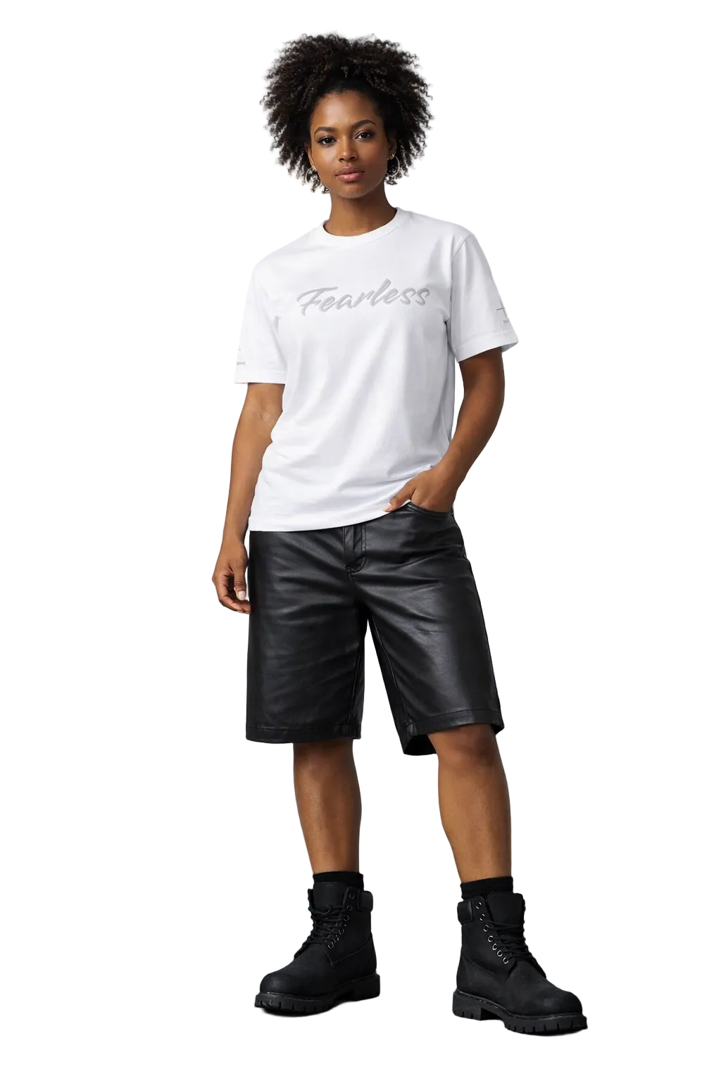 Person wearing a white t-shirt with 'Fearless' text, black leather shorts, and black boots on a gray background