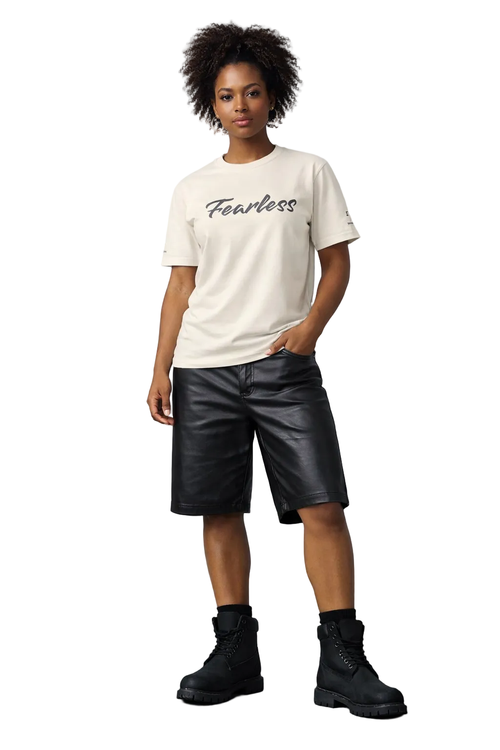 Person wearing a white t-shirt with 'Fearless' text, black leather shorts, and black boots against a gray background.