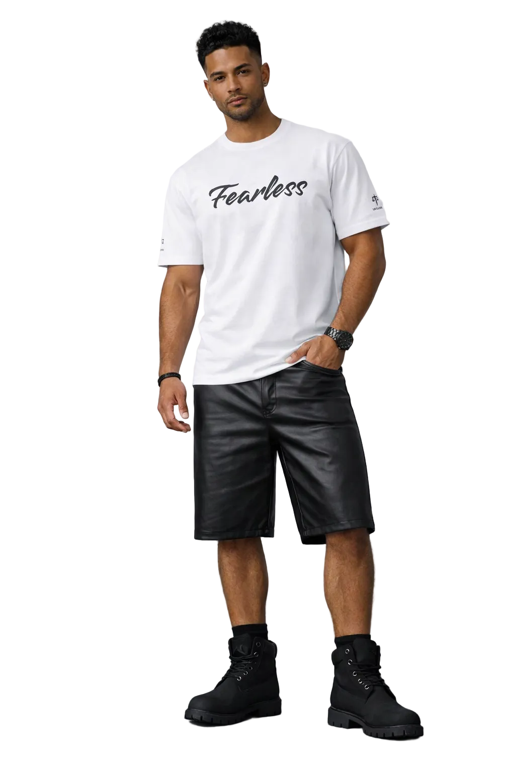 Man wearing a white t-shirt with 'Fearless' text, black leather shorts, and black boots against a gray background.