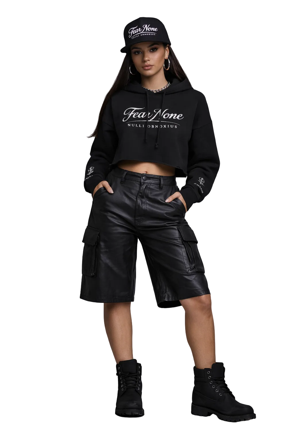 Person wearing a black hoodie, leather shorts, and black boots on a gray background