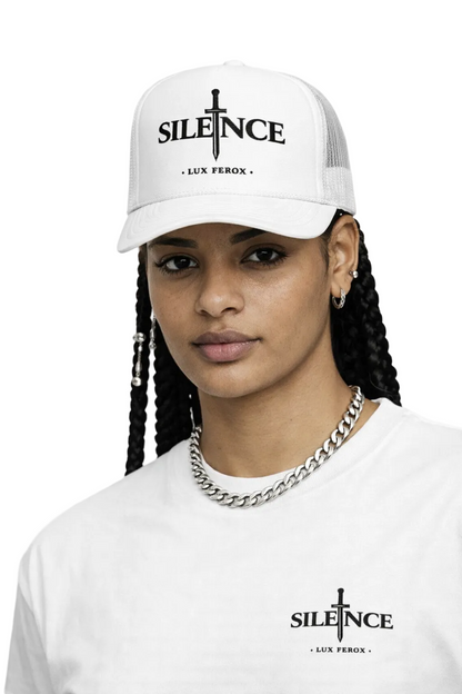 Person wearing a white cap and shirt with 'SILENCE' branding on a plain background