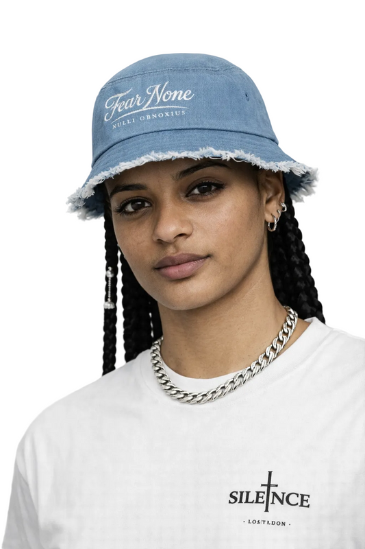 Person wearing a blue bucket hat with text and a white shirt with a logo, against a light background