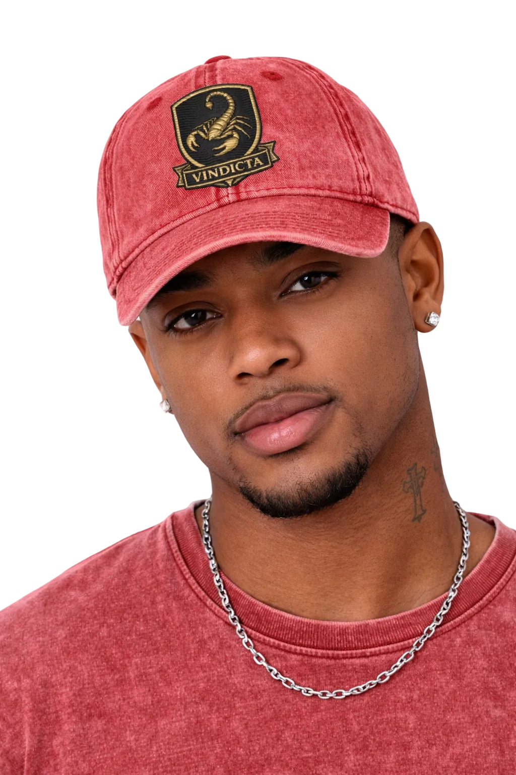 Man wearing a red cap with a logo and matching shirt against a white background