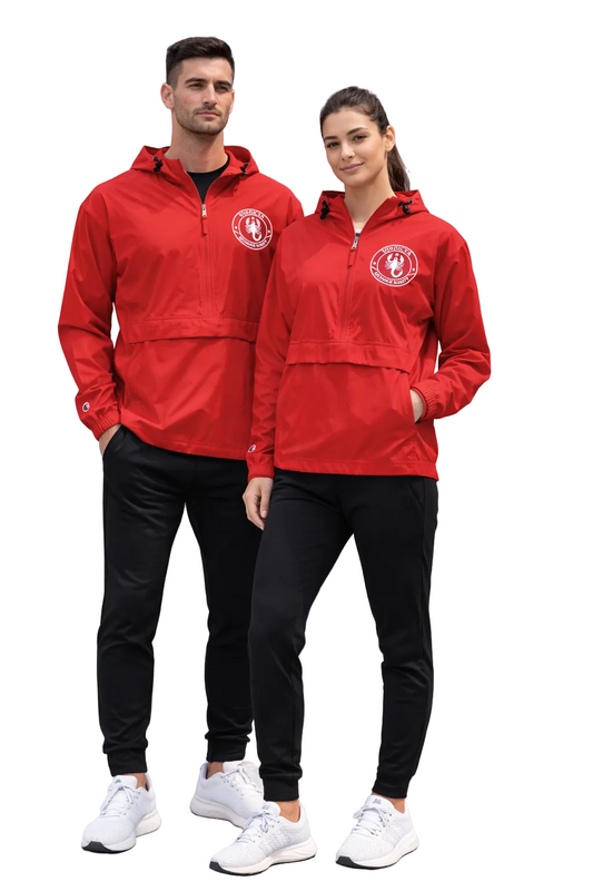 Two people wearing matching red jackets and black pants standing on a concrete surface.