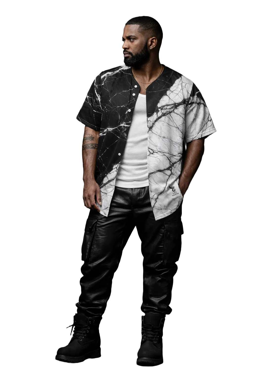 Man wearing a marble-patterned shirt and leather pants against a dark background