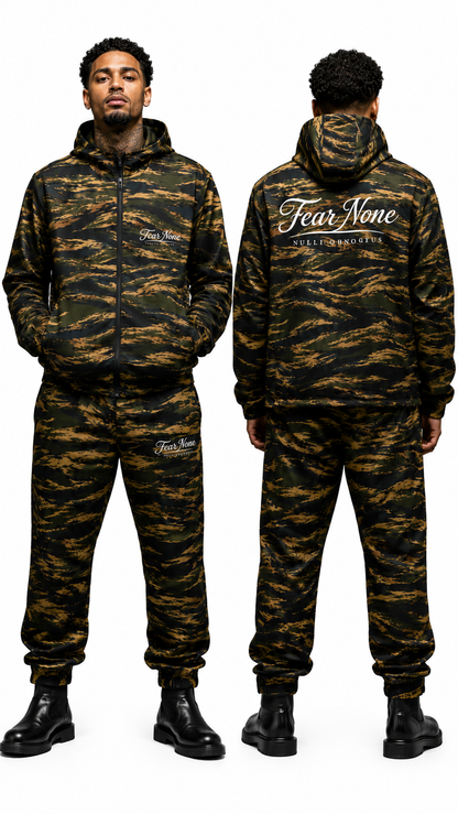 A man modeling a matching camouflage hoodie and jogger sweatpants set, shown from both the front and back views against a plain white background. The set features a dark green, black, and brown tiger stripe camouflage pattern with white 'Fear None' brand text on the chest and back.
