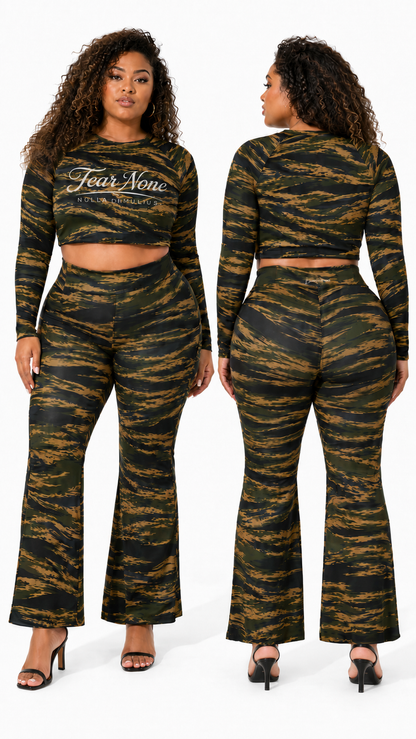 A plus-size model is shown from the front and back wearing a matching two-piece tiger-stripe print set. The set includes a long-sleeve crop top with 'Fear Now' printed on the chest and matching high-waisted flare pants.