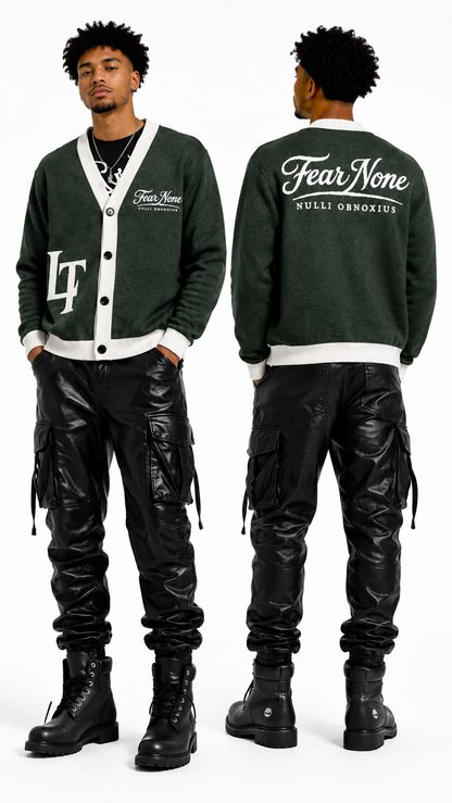 Man wearing a green varsity jacket with 'Fear None' text, black pants, and boots on a white background.