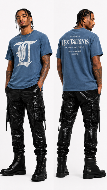 Person wearing a blue t-shirt with a logo and text, paired with black pants and boots on a white background.
