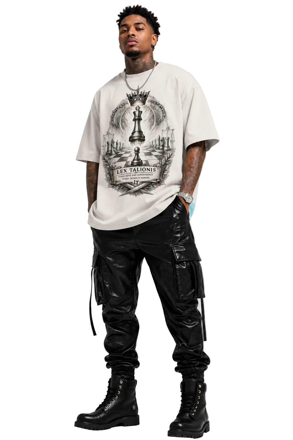 Man wearing a graphic t-shirt, black cargo pants, and black boots on a white background