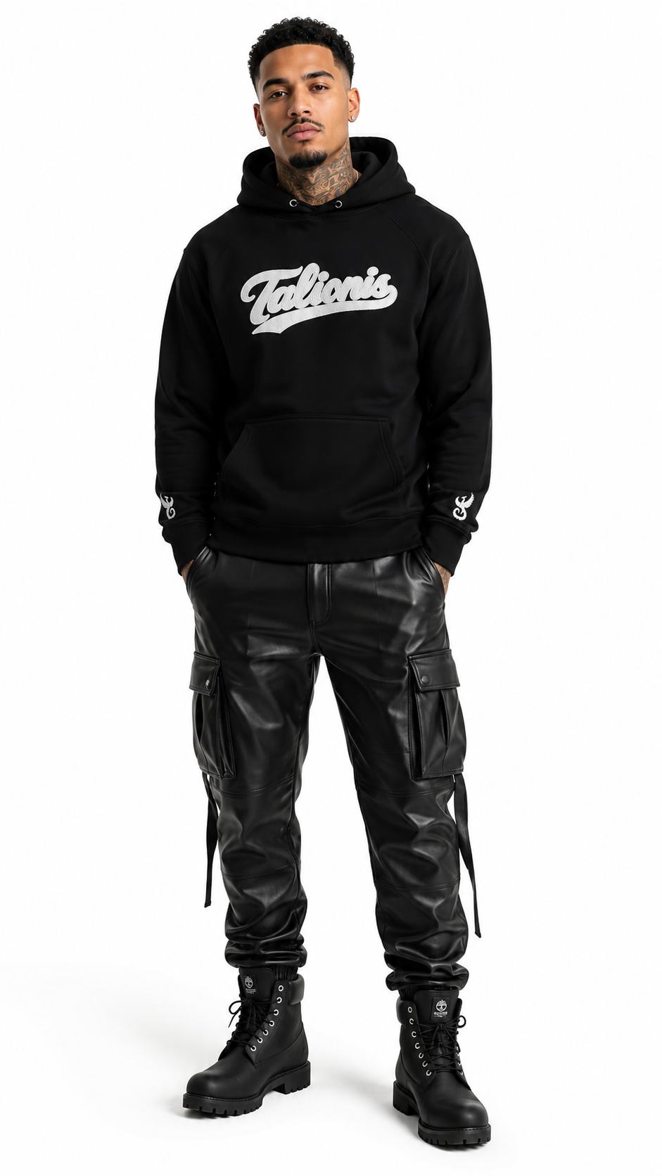 Person wearing a black hoodie with 'Falkor's' logo and black leather pants on a white background