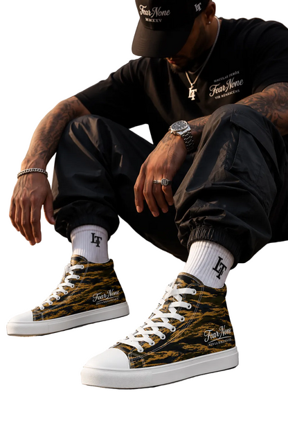 Person wearing camouflage high-top sneakers sitting on concrete steps.
