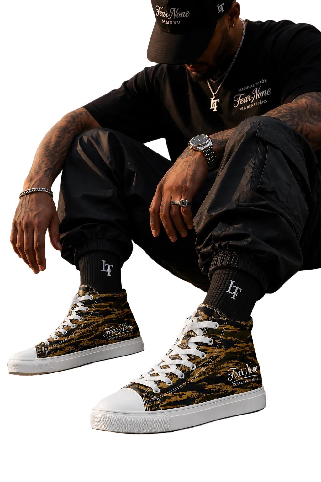Person wearing black high-top sneakers with a pattern, black pants, and a black cap sitting on steps.