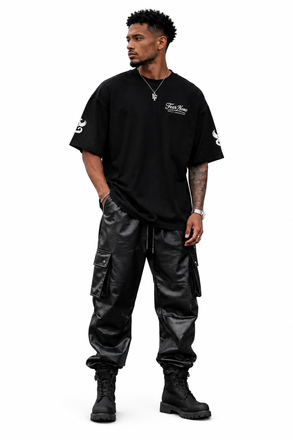 Man wearing a black t-shirt and cargo pants on a white background