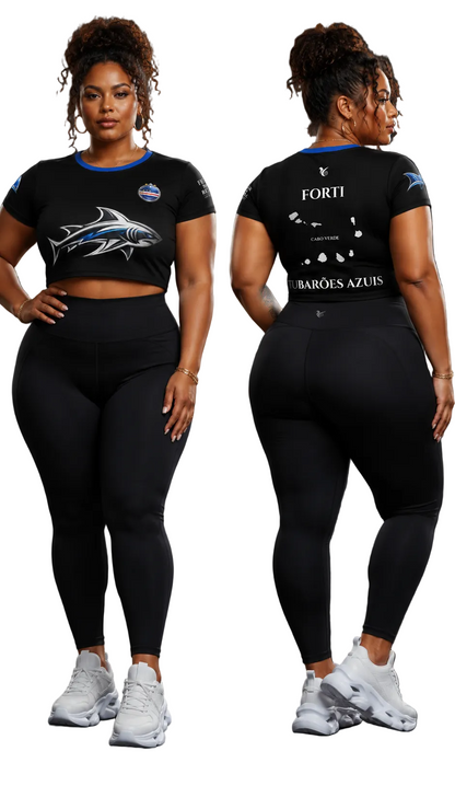 Woman wearing a black athletic outfit with visible branding on a dark background