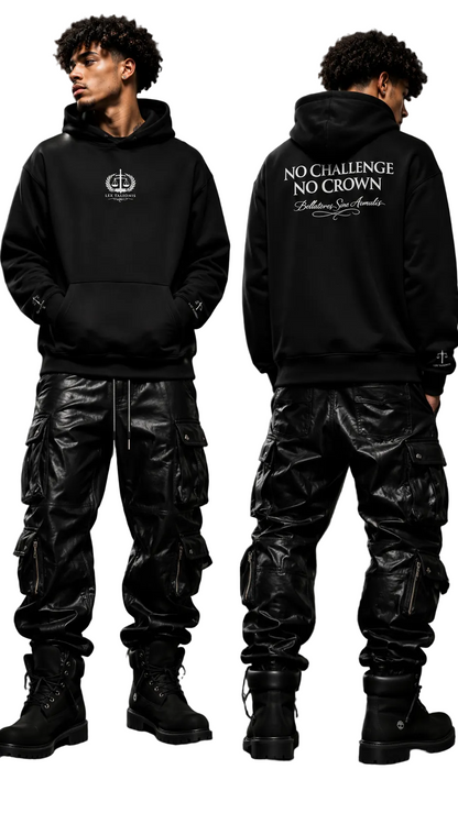 Person wearing a black hoodie with text, standing against a dark background